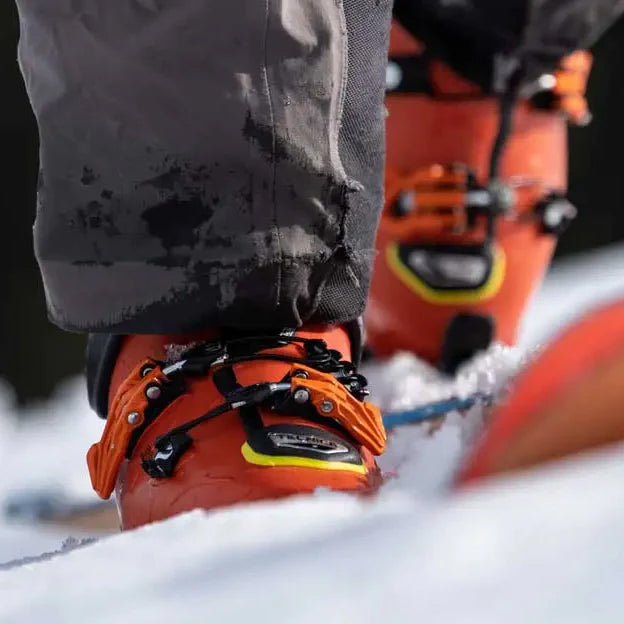 ski boots and board on snow